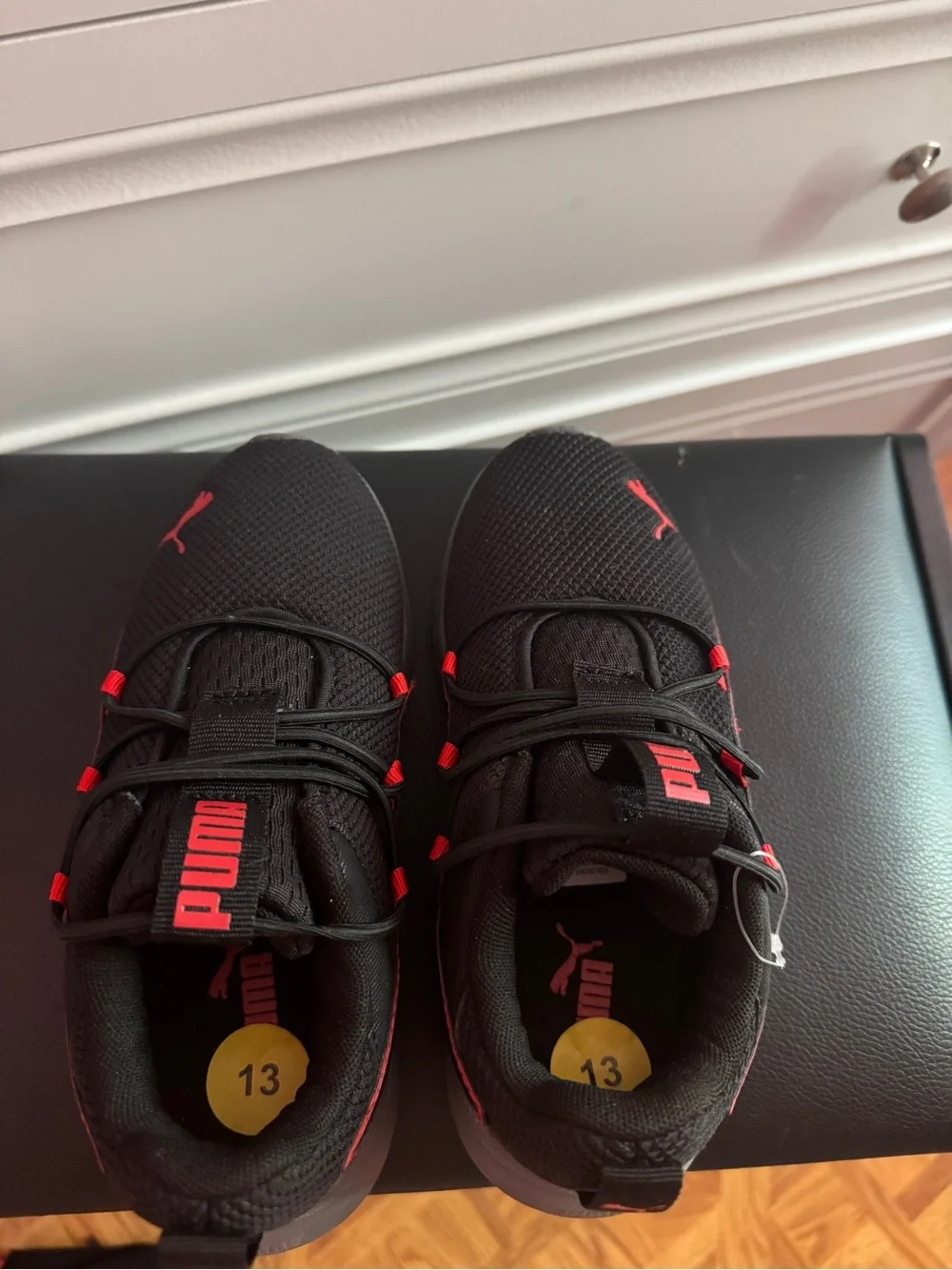 Puma Kids Black Sneakers with Red Accents